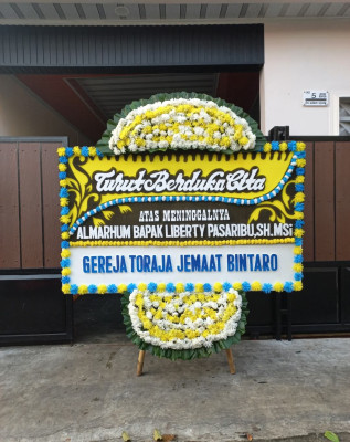 Papan Bunga Duka di Serba Jadi